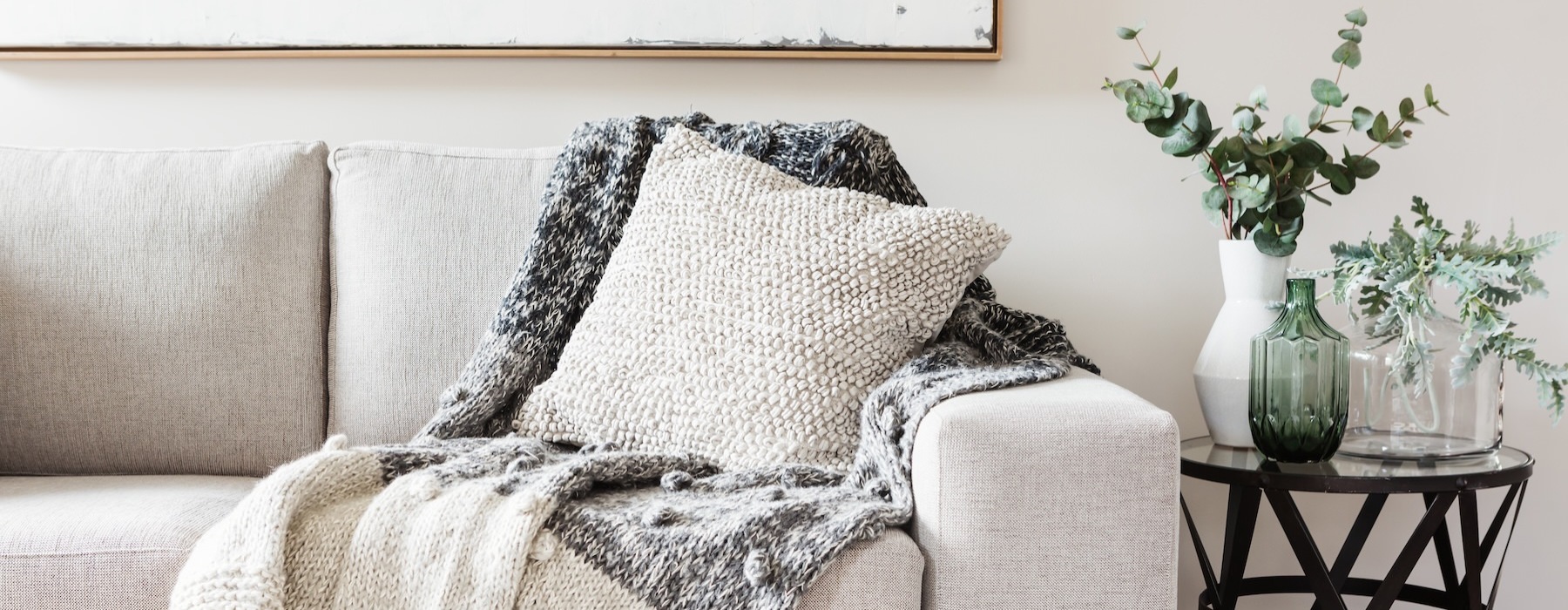 a couch with a white pillow
