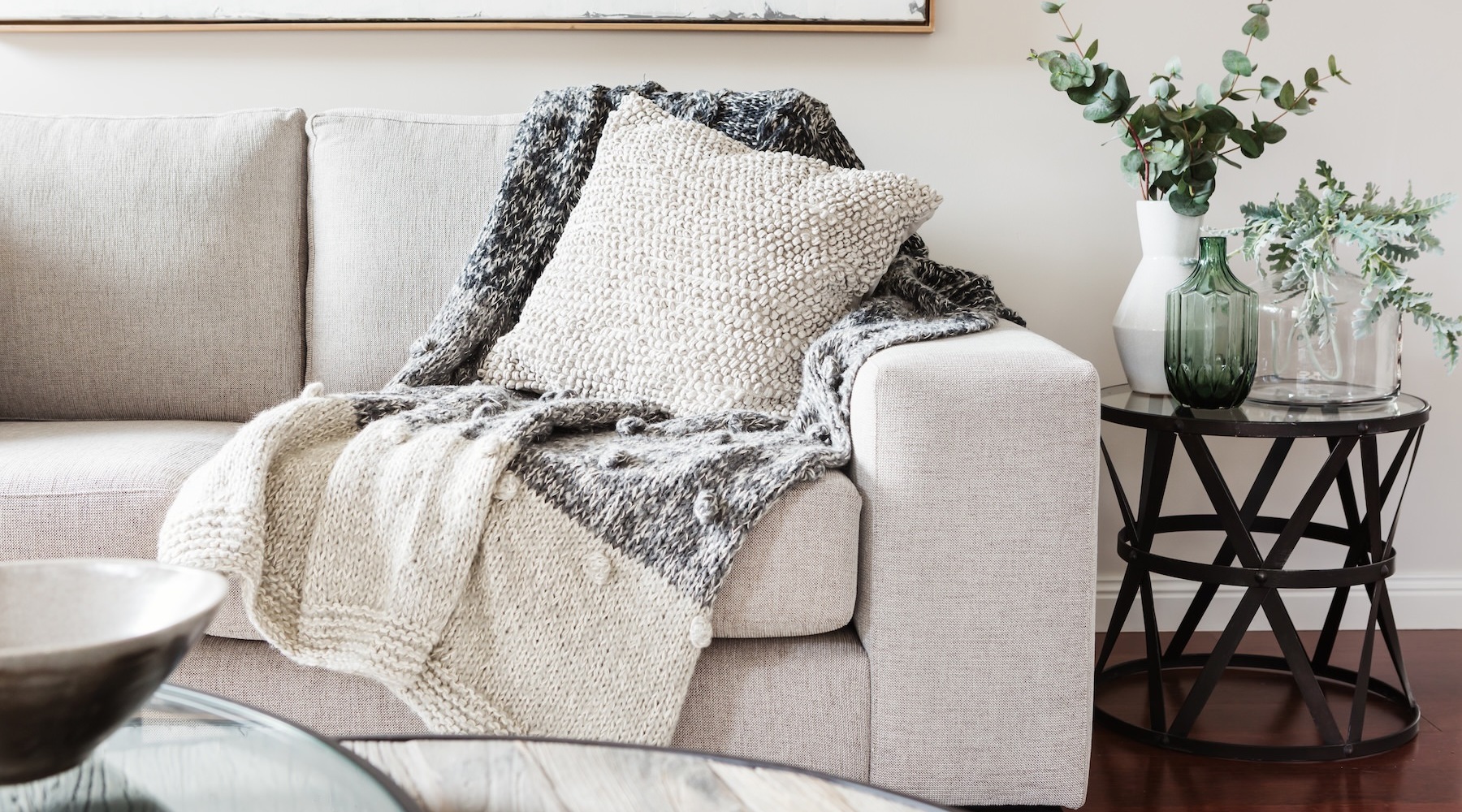 a couch with a white pillow