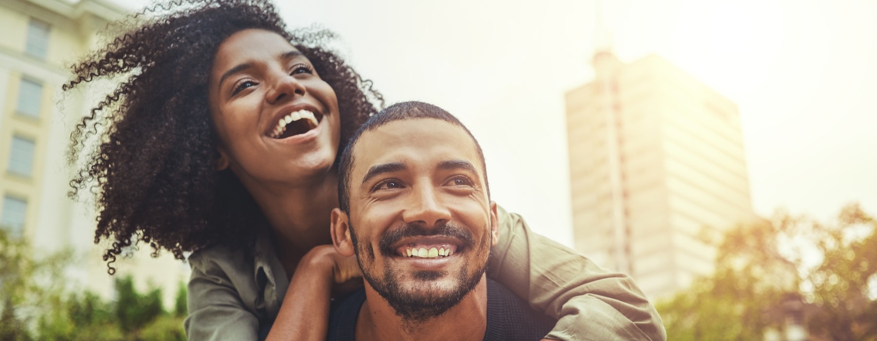 a man giving a woman a piggy back ride